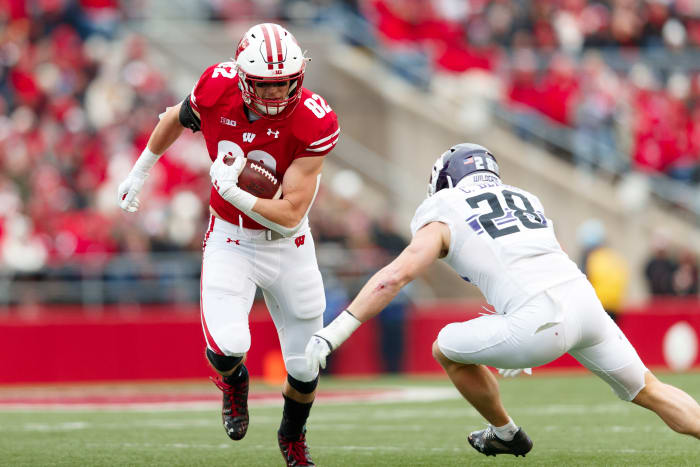 Wisconsin tight end Jack Eschenbach breaks a tackle against Northwestern.